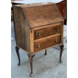 A small 20th century oak bureau on cabriole legs, 65x44x101cmH