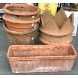 Three large terracotta plant pots, each approx. 33cmD; together with a chimney and a terracotta