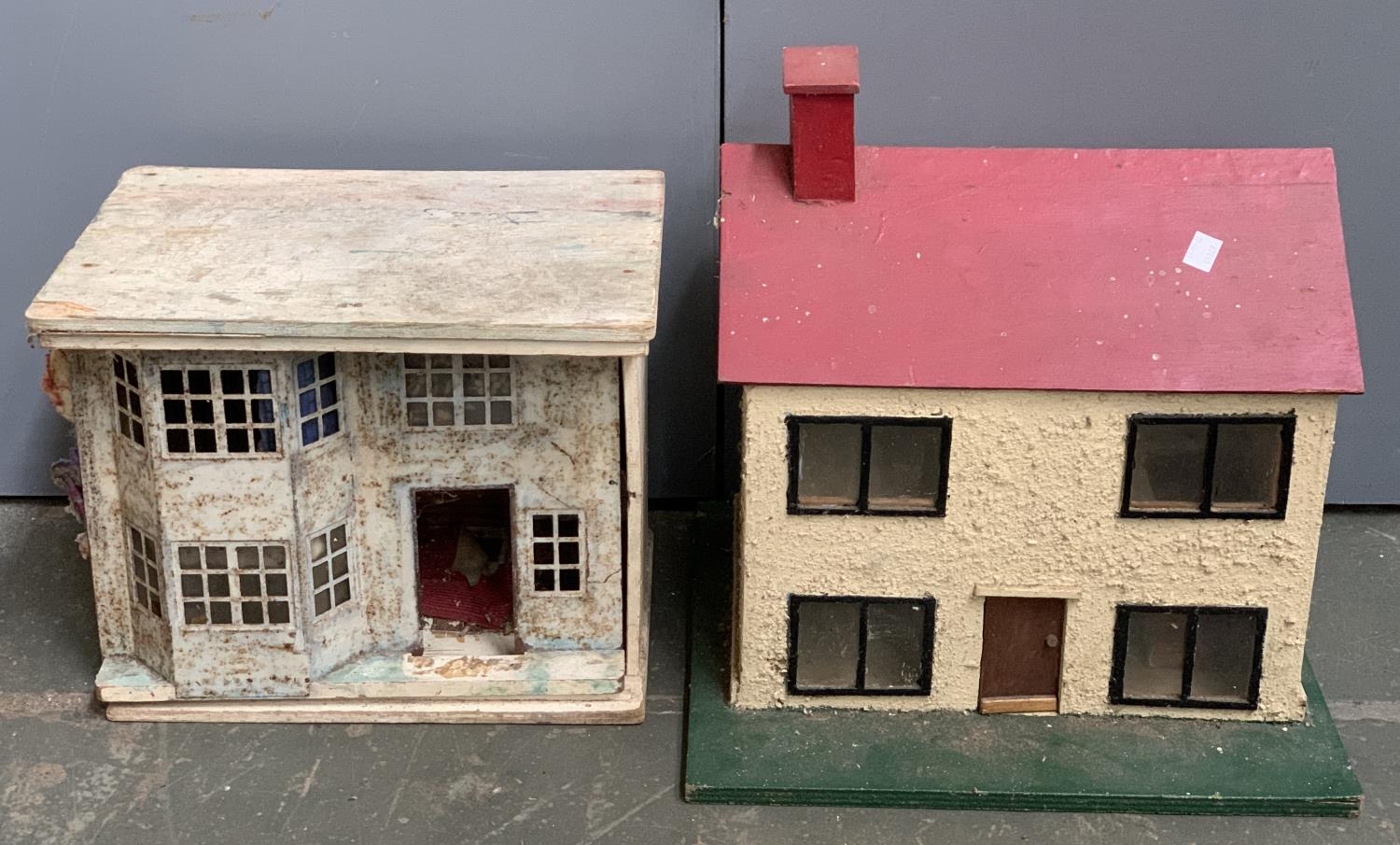 A small two storey dolls' house with flat roof, 33.5x23x28.5cmH, together with an open back two