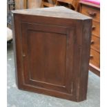 A stained pine corner cupboard, 75cmW