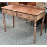 A Victorian mahogany writing desk (af), two frieze drawers, on turned legs (all legs af),