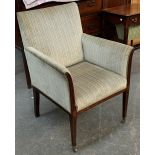 A neat Edwardian armchair, upholstered in striped fabric, mahogany with marquetry detail and brass