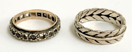 An Art Deco silver and gold eternity ring set with paste (some missing); together with a white metal