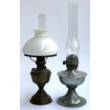 A copper oil lamp with chimney and milk glass shade, 52cmH overall, together with one other
