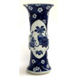 A blue and white Chinese sleeve vase decorated with precious object panels, and prunus ground,