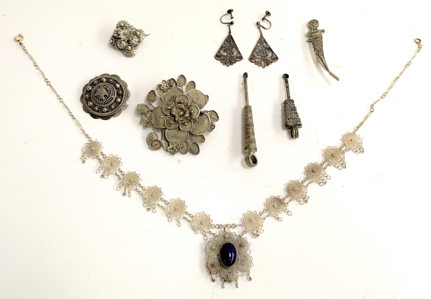 A quantity of white metal items, mainly filigree, to include necklace set with a blue cabochon,