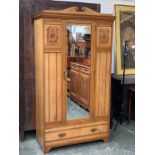 A good late Victorian estate made ash hanging wardrobe, with swan neck pediment, over single