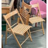 A set of three Mopani beechwood folding chairs