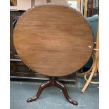 A mahohany circular tip-top tripod table, 91cmD 70cmH