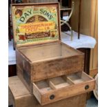 A vintage pine storage box, with compartmented drawer below, bears label to underside of lid '