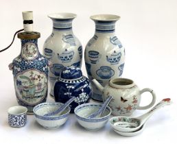 A quantity of ceramics to include Chinese rice ware bowls and spoons; vases with cup decoration,