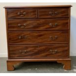 A George III style chest of two short over three long drawers on bracket feet, 88x48x87cmH