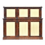 A Regency two tier rosewood sideboard or credenza, three quarter pierced brass gallery top over