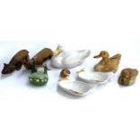 A mixed lot to include carved wooden rhino and bison, Italian glazed terracotta duck side dishes,