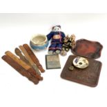 A mixed lot of Chinese items to include dolls; figural bottle; page turners; brass stand(?)