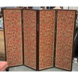A four fold screen, upholstered in a floral printed fabric, each panel 32x140cm; together with a