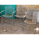 A set of four metal garden chairs