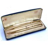 A case set comprising gold plated pen and propelling pencil