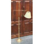 A gilt metal adjustable standard lamp, 147cmH