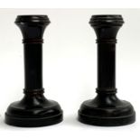 A pair of small turned ebony treen candlesticks, 11cmH