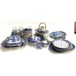 A large mixed lot of blue and white, mainly Willow, to include tureen, meat plate, Furnivals,