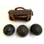 A vintage leather bowls bag, 26cmW; together with three bowls, one Thomas Taylor of Glasgow, the