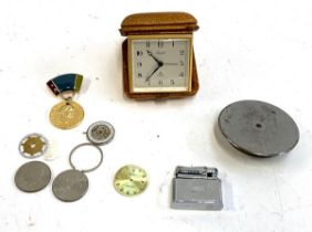 A mixed lot to include Imhof 15J desk clock, several scraps of watch movements, replica medal, etc