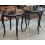 Interior design interest: a pair of smart circular occasional tables, black marble tops, with