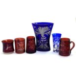 Four Victorian cranberry glass mugs, inscribed 'Jack', 'For a Good Boy', 'Think of Me', and '