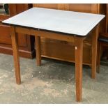A mid century white enamel topped kitchen table, on pine base, by Remploy Ltd., 64x92x77cm