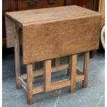 A Cotswold school light oak gateleg table, rectangular top, on octagonal faceted supports,