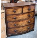 A Victorian bowfront mahogany chest of two short over three long graduating drawers, shaped apron