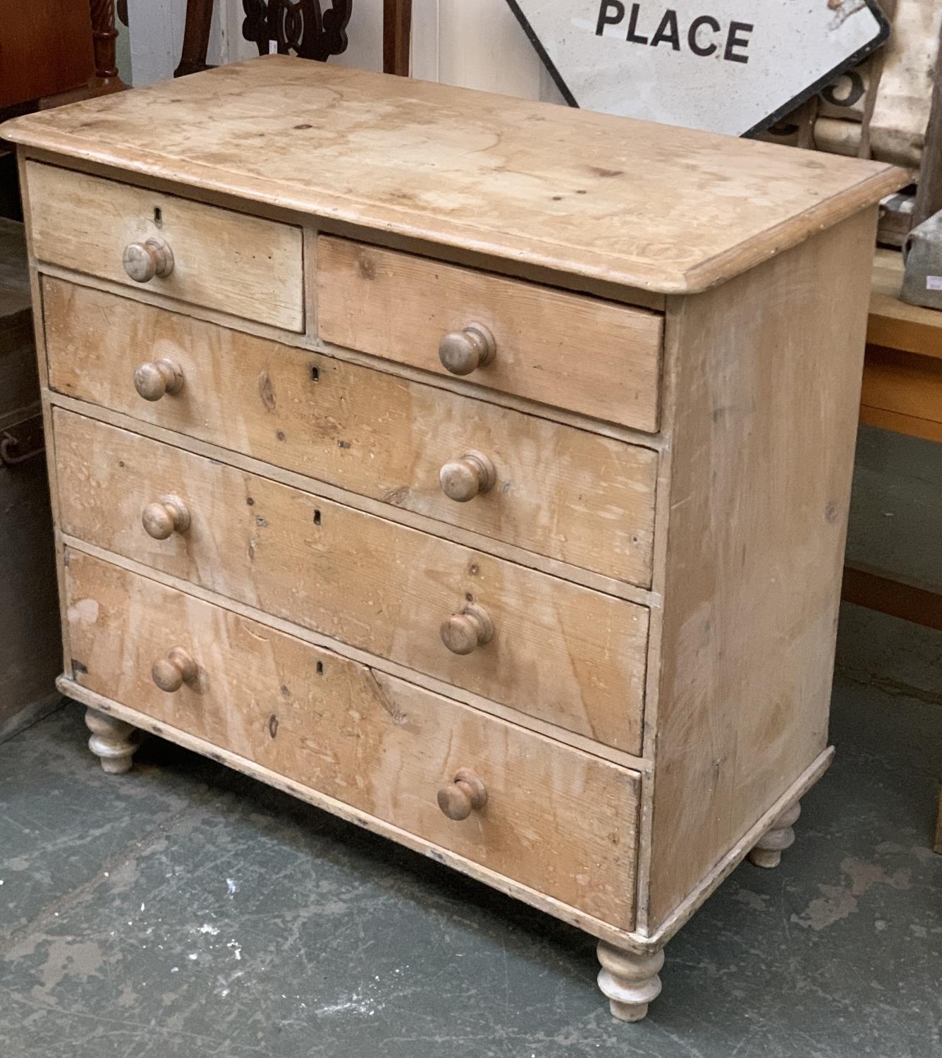 A Victorian pine chest of two short over three graduating long drawers, on turned legs, 102x52x96cmH