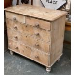 A Victorian pine chest of two short over three graduating long drawers, on turned legs, 102x52x96cmH