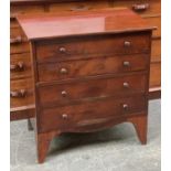 A 19th century commode in the form of a small chest of drawers, lift up lid, liner absent,