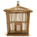 A vintage Spanish wicker basket cage, with hinged door, 36cmH