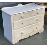 A white painted oak chest of two short over two long drawers, on bracket feet, 104x46x72cmH
