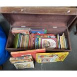 A pine storage box containing a quantity of children's to include Alison Uttley, the box 69cmW
