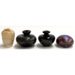 An Isle of Wight iridescent glass paperweight, 7.5cmD; two art glass vases; and one other, signed