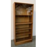 A Cumbrae Furniture by Morris of Glasgow mid century glazed bookshelf, with two sets of sliding