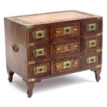 An Anglo-Indian carved hardwood and brass inlaid specimen chest, brass bound with campaign style