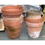Six terracotta plant pots, each approx. 28cmD; together with a twin handled urn