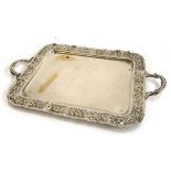 A silver coloured oblong tray stamped Argent 1000, with later loop handles and an embossed flower