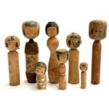 A collection of eight Japanese kokeshi dolls, the tallest 30cmH