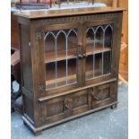 An oak lead glazed bookshelf, 102cmW