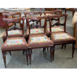 A set of six Victorian mahogany dining chairs, carved with Fleur De Lis midrail, with stuffover
