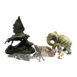 Several white metal figures to include fox; dog; waterfowl; a spelter cast figure of a jackdaw; etc
