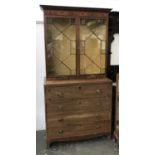 A Regency mahogany astragal glazed secretaire bookcase with fitted interior, over a further three