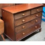 A large 19th century mahogany chest of two short over three long drawers, on bracket feet, turned
