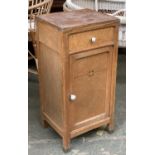 A French bedside cabinet, single drawer over a cupboard, opening to two ceramic liners, 38x33x79cmH